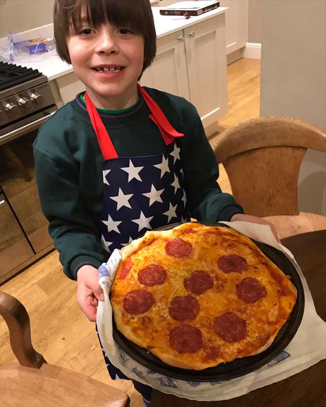 cubs cooking pizza big smile