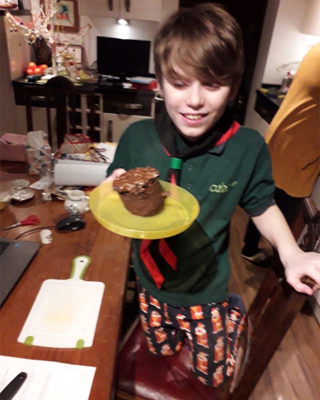 cubs holding cake on a plate